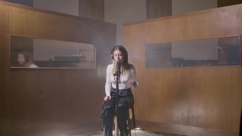 Beautiful Female Singer Working in Music Studio