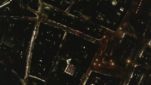 Top Down Panning Footage of Town Development and Illuminated Streets in Night City