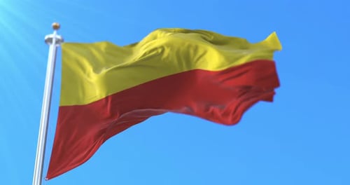 Karnataka Flag Waving in Wind Against Clear Blue Sky