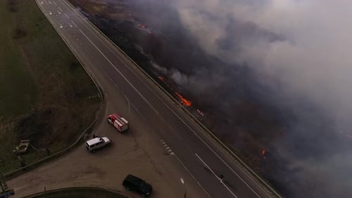 Wildfire Burns Near Highway, Aerial View
