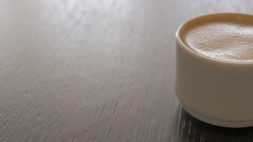 Cup of Espresso on Dark Wood Table