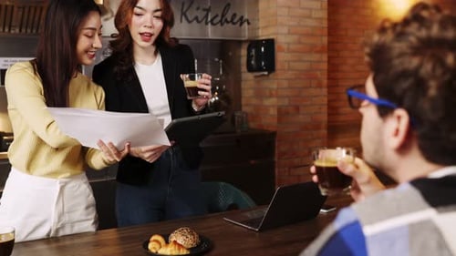 Teamwork in an Office Looking at Documents