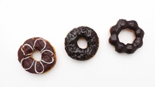 Chocolate donuts on a white background