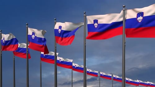 Slovenia National Flags Waving on Flagpoles Under Blue Sky