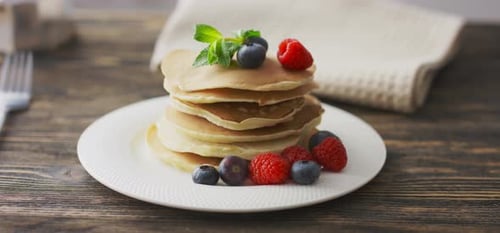 Food and Cooking Concept. Stack of Pancakes with Fresh Berry, Rotate Shot