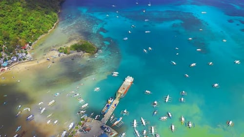 Boats in the Turquoise Lagoon Near City El Nido, Aerial View. Seascape with Blue Bay and Boats View