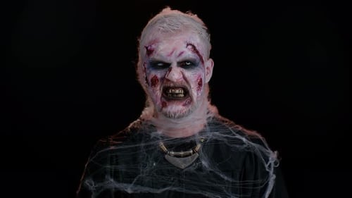 Scary Monster with Halloween Makeup in Close Up