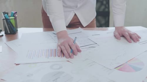 Businessman working with charts in the office at the table