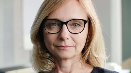 Smiling mature woman in glasses