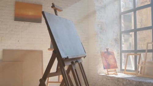 Clear Canvas on Wooden Easel Ready To Be Painted in Art Workshop