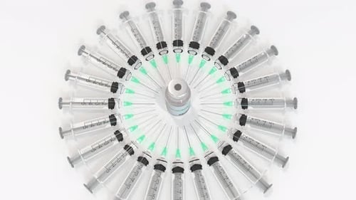 Vaccine Vial Surrounded by Syringes Animation