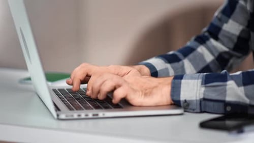 Confident Male Hands Typing Press Button on Keyboard of Laptop Pc