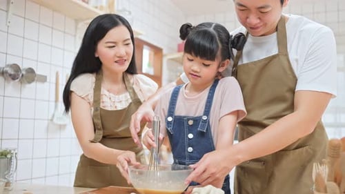 Family Baking Together in a Bright Kitchen