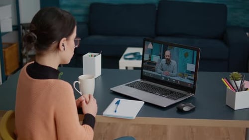 Young Woman Meeting with Teacher on Remote Video Call