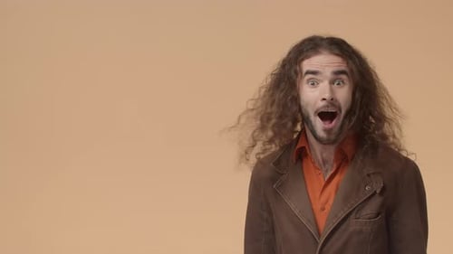 Man Reacts with Surprise and Gestures to Side