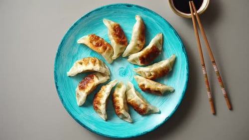 Freshly Cooked Dumplings on a Blue Plate