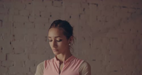 Elegant Young Ballerina Dancing in Studio