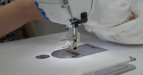 Sewing Machine Working With White Fabric Close Up