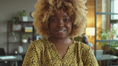 Portrait of Cheerful African American Businesswoman in Office