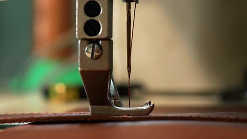 Leather Belt Sewing with a Sewing Machine. View From the Side. Close Up
