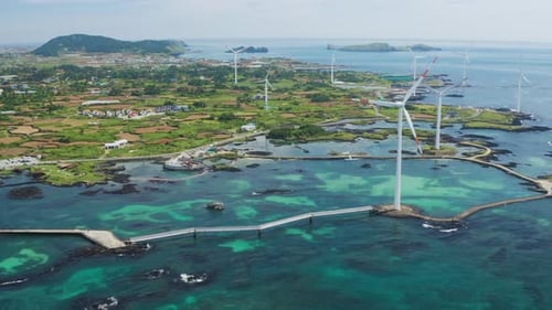 Blue sky and sea and wind turbine. Green energy and environment. Drone View.