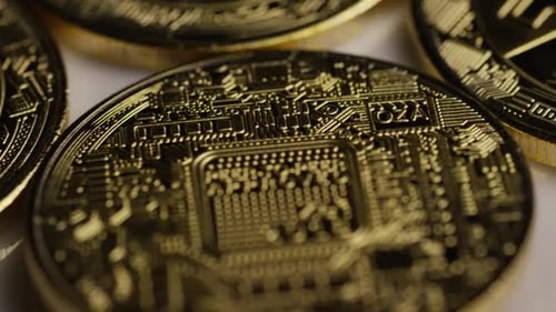 Rotating shot of Bitcoins (digital cryptocurrency) - BITCOIN 0357