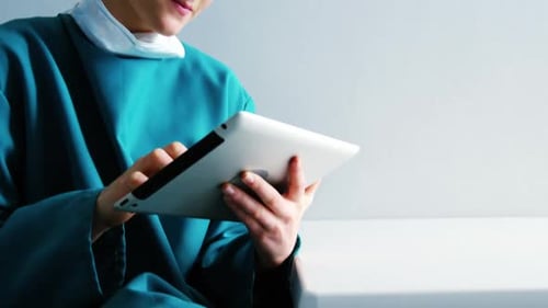 Female doctor using digital tablet