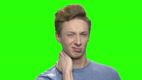 Man Rubbing his Neck in Pain on Green Screen