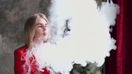 Stylish Young Girl in a City with Vape