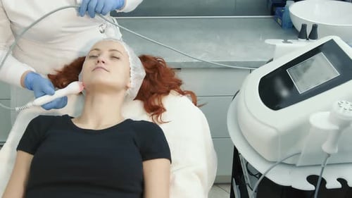 Woman Receiving Facial Treatment at Medical Spa
