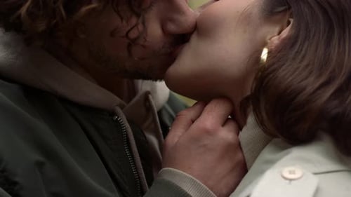 Romantic Couple Kissing Intimately in City Setting