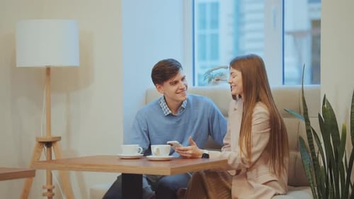 Loving Couple Having Romantic Date in Cafe