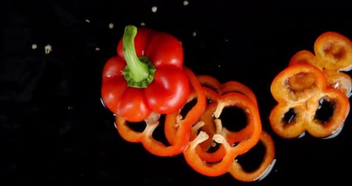 Sweet Red Pepper Falls on the Table and Breaks Into Pieces.