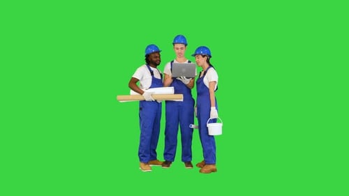 Multiethnic Diverse Team of Engineers Working on a Laptop on a Green Screen Chroma Key