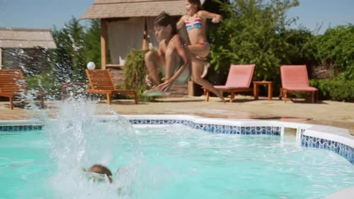 Four Kids Jumping Into Pool with Long Run and Swimming Bathing in Slowmotion