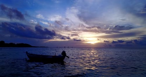 Wide angle overhead island view of a paradise sunny white sand beach and blue sea background in colo