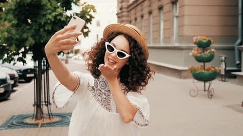 Stylish Woman Posing for Selfie on City Street