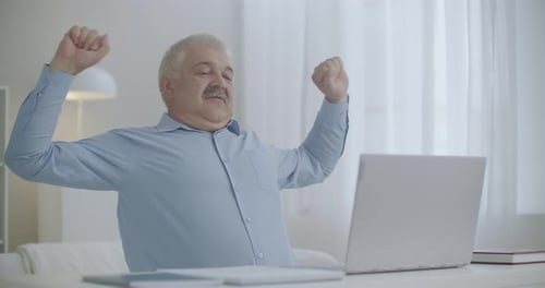 Man Working From Home Stretches