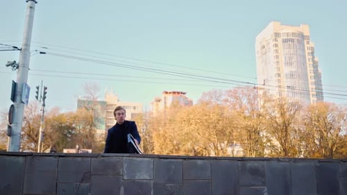 Successful Business Man with Folder Documents Jumping Over Obstacle Urban