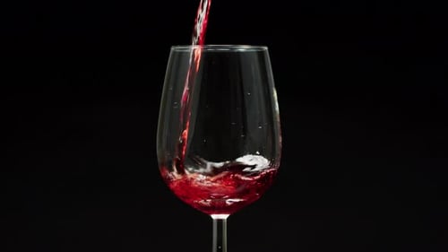 Pouring red wine