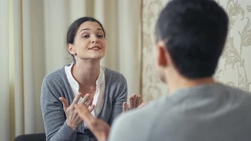 Frustrated Woman Arguing with Someone Indoors