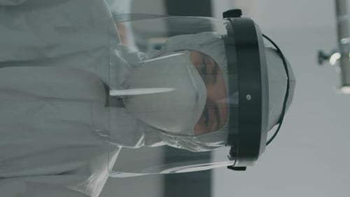 Person in Hazmat Suit With Face Shield and Mask