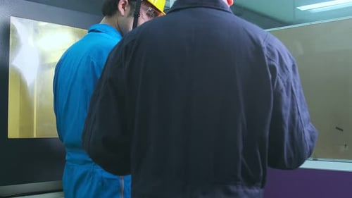 Professional engineering walking discuss inspecting with engineer team machinery factory area