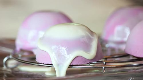 Delicate Pink Cakes Covered in White Glaze