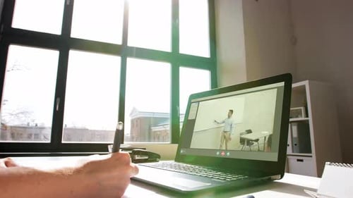 Woman with Laptop Having Video Call at Office