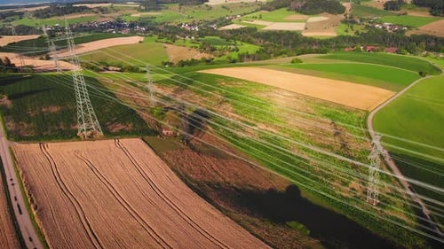 Aerial View of Power Lines Across Rural Farmland