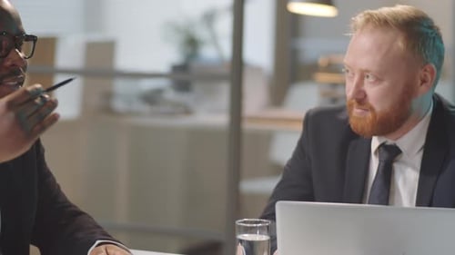 Multiethnic Business Partners Talking in Office