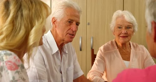 Group of Four Laughing and Talking Together