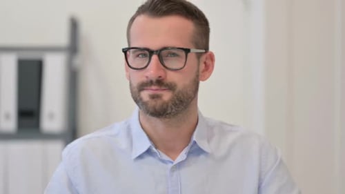 Man Shakes Head No, Raises Finger