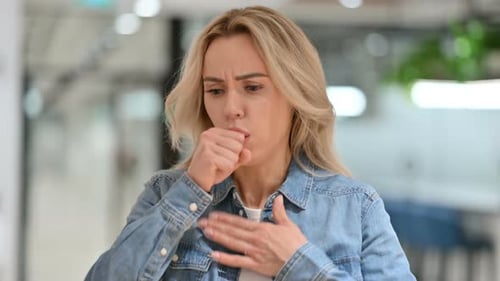 Woman Coughing into Hand, Close Up Shot